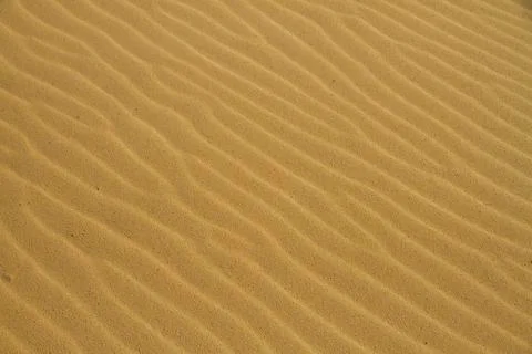 Golden sand texture Stock Photos