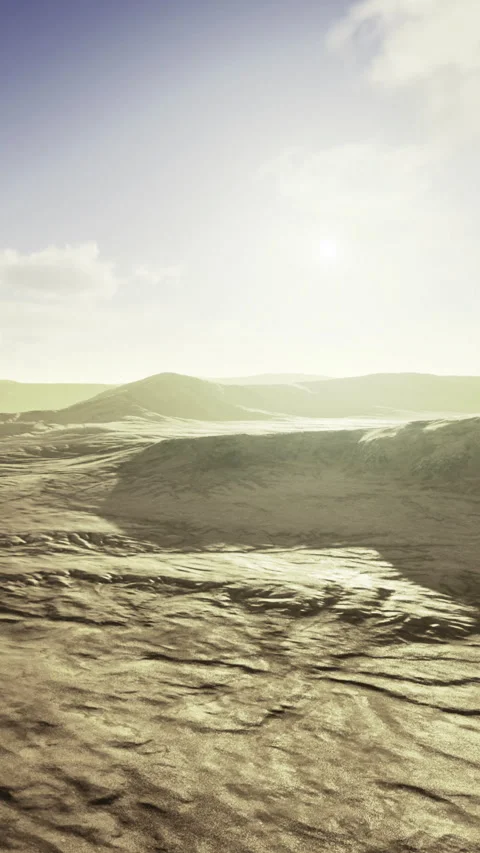 Golden sands stretch under a bright sky in a serene landscape at sunset 库存影片 334247219