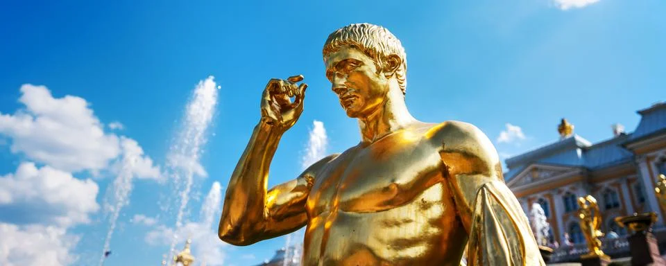 Golden sculpture of antique man piece of Grand cascade monument Stock Photos