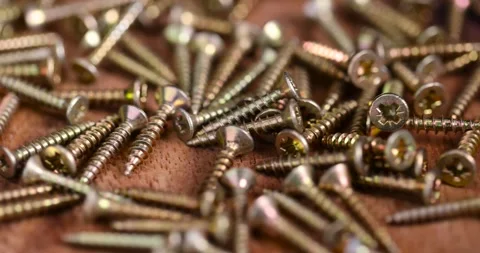 Golden self-tapping screws for installation and construction work with wood, Stock Footage 280635462