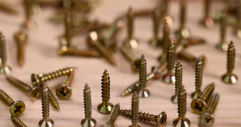 Golden self-tapping screws for installation and construction work with wood, Stock Footage 281388869