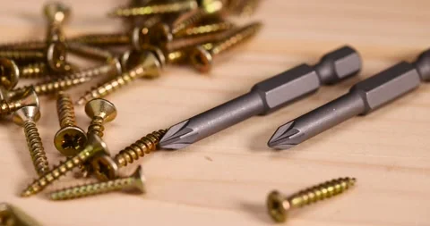 Golden self-tapping screws for installation and construction work with wood, Stock Footage 282841598