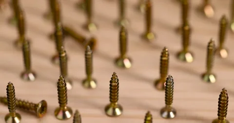 Golden self-tapping screws for installation and construction work with wood, Stock Footage 283881193