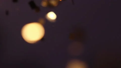 Golden sequins fall from above, the concept of the holiday Stock Footage 169952472