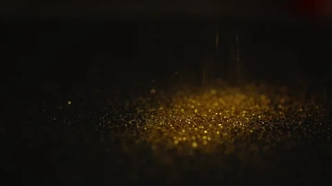 Golden sequins fall on a black glitter background Stock-Footage 222814509