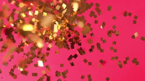 Golden sequins fall on a red background, the concept of the holiday. Stock Footage 170380742