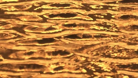 Golden shiny waves water surface background Stock Footage 142991037