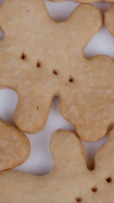 Golden shortbread bear pattern. Baked cookies with crumbly texture and features. Stock Footage 337350528