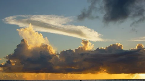 Golden sky and clouds at sunset. Slow motion. Stock Footage 101470704