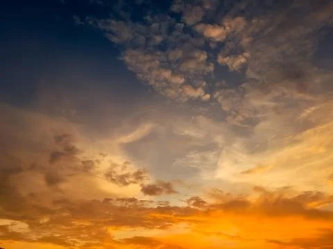 Golden Sky with Clouds at Sunset 스톡 사진