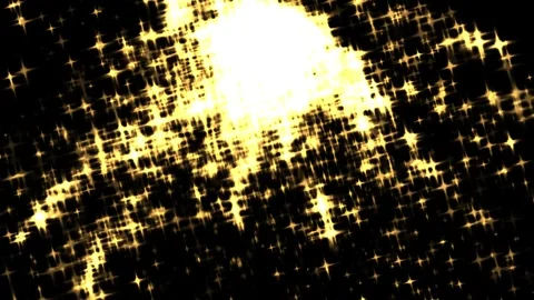 Golden sparkles explode across a deep black field 스톡 동영상 330738505