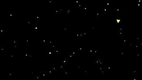 Golden sparkles floating downwards against a deep black background with warm Видео 345101989