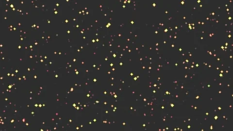 Golden sparks drift across a deep black void Видео 340528863