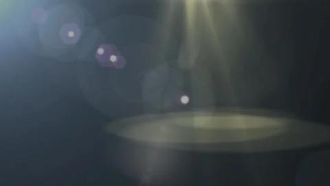 Golden spotlight beams casting dramatic circular glows against deep dark Stock Footage 340611050