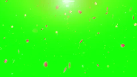 Golden star confetti falling downwards against vibrant green screen background Stock Footage 345334646