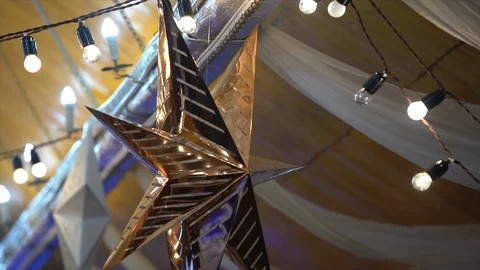 Golden star hanging from the ceiling Stock Footage 101731371