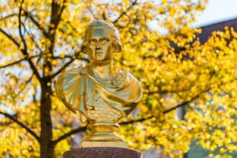 Golden statue in fall Stock Photos