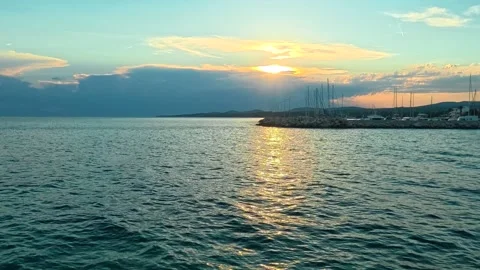 Golden sun dips low over calm sea waters. Nikiti, Greece Stock Footage 339609582