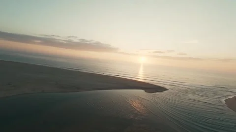 Golden sun dips over calm ocean waves Stock Footage 340227786