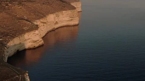 Golden Sun hitting Dingli Cliffs at sunset Stock Footage 113012532