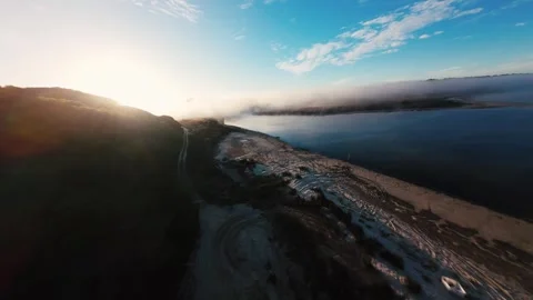 Golden sun peeks through misty hills Stock Footage 340903957