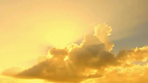 Golden Sun Rays Breaking Through Cumulus Clouds at Sunrise Video stock 310818102