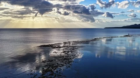 Golden Sun Rays Illuminate Mahaba Beach at Low Tide Stock Footage 333701955