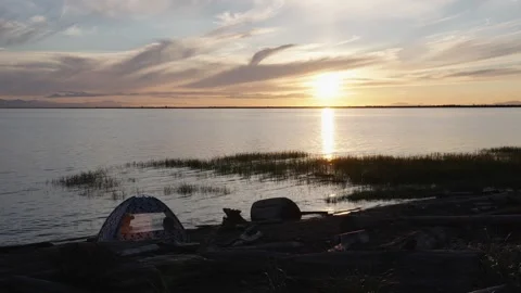 Golden Sun Reflection Over Calm Lake at Sunset Stock Footage 254982458