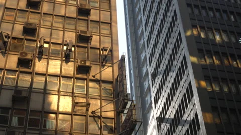 Golden sun reflection through highrise on Hong Kong old residence building ci Stock Footage 156292925