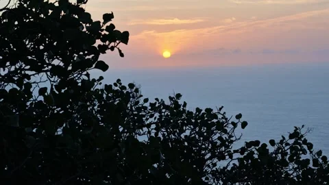 Golden Sun Sets Behind Hazy Sea With Horizon Hidden Beneath Soft Evening Clouds Stock Footage 344007763