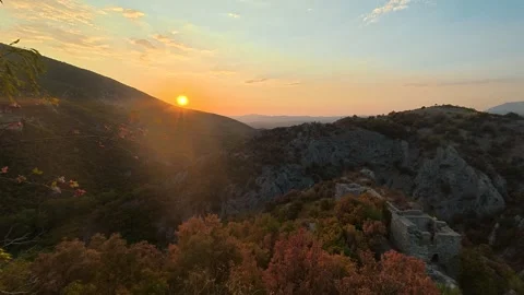Golden sun sets over rugged hills. Soko Grad, Serbia 動画素材 345896906