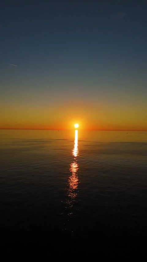 Golden sun setting over calm adriatic sea in rovinj, croatia Stock Footage 336472865