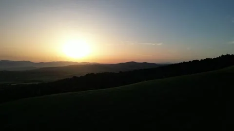 Golden Sun Setting Over Rolling Hills Landscape in Tuscany, Grosseto, Italy Stock Footage 335825295