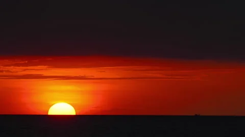 Golden sun setting over the tranquil sea Stock Footage 325421175