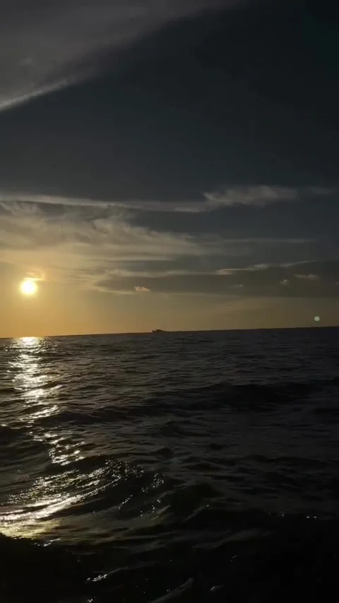Golden Sun Shining Over Open Ocean Waves at Sunset Stock Footage 341319238