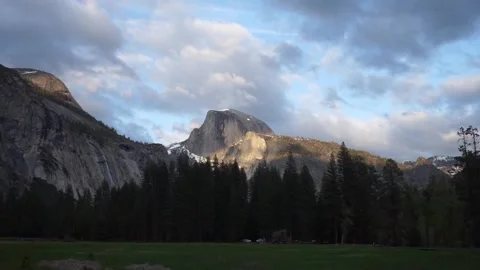 Golden sunlight and dark clouds on Half Dome during sunset, Spring 2023 Stockbeeldmateriaal 241194130