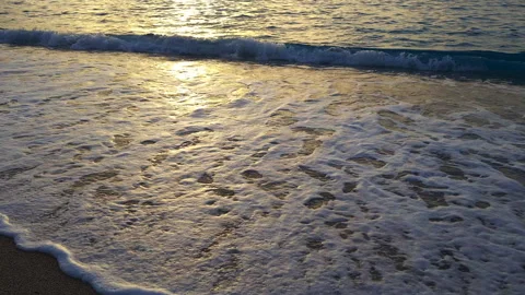 Golden sunlight on beach waves at sunset. Stock Footage 255299680