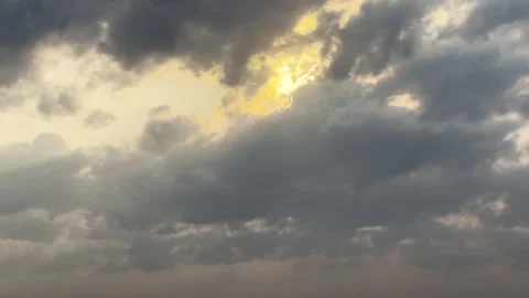 Golden Sunlight Breaking Through Dramatic Cloud Cover Video stock 311759697