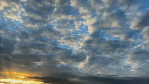 Golden Sunlight Breaking Through Storm Clouds Time Lapse Stockbeeldmateriaal 347864586