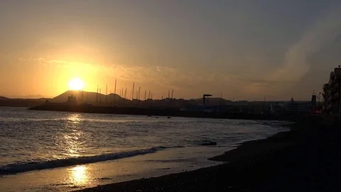 Golden sunset behind mountain next to Spanish coastal village in Costa del Video stock 80618024