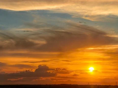 Golden Sunset Close View With Dramatic Clouds Stock Photos