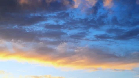 Golden Sunset Clouds Against Deep Blue Sky. Dramatic Evening Sky Stock Footage 339619419