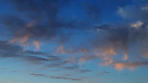Golden Sunset Clouds Against Deep Blue Sky. Dramatic Evening Sky Stock Footage 339619841