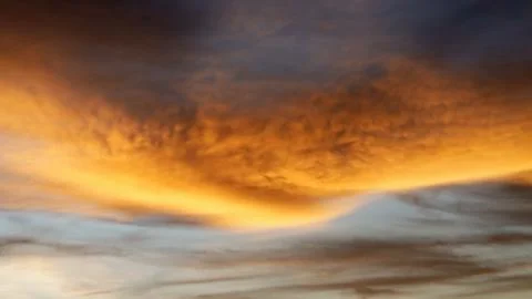 Golden Sunset Clouds in Dramatic Evening Sky Stock Photos