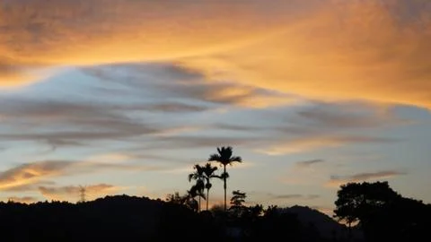 Golden Sunset Clouds in Dramatic Evening Sky Stock Photos