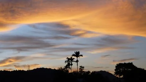 Golden Sunset Clouds in Dramatic Evening Sky Stock Photos