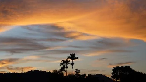 Golden Sunset Clouds in Dramatic Evening Sky Stock Photos