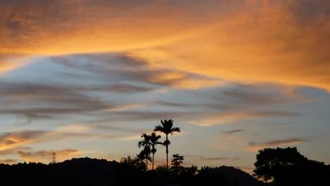 Golden Sunset Clouds in Dramatic Evening Sky Stock Photos