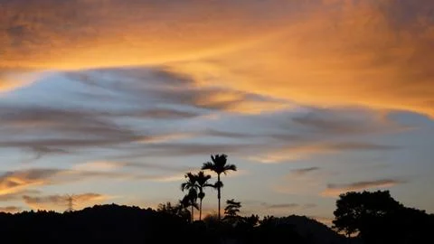 Golden Sunset Clouds in Dramatic Evening Sky Stock Photos