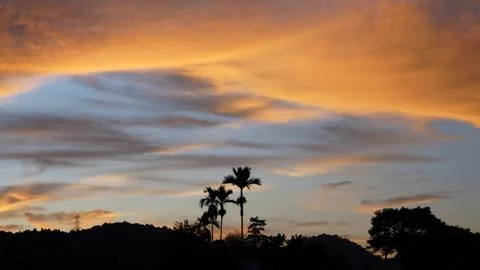 Golden Sunset Clouds in Dramatic Evening Sky Stock Photos